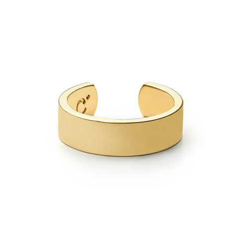 A slim gold cuff ring with inscription