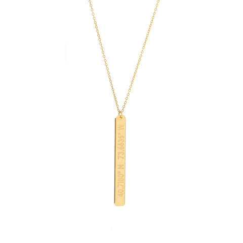 A long gold vertical pendant with inscription on gold chain