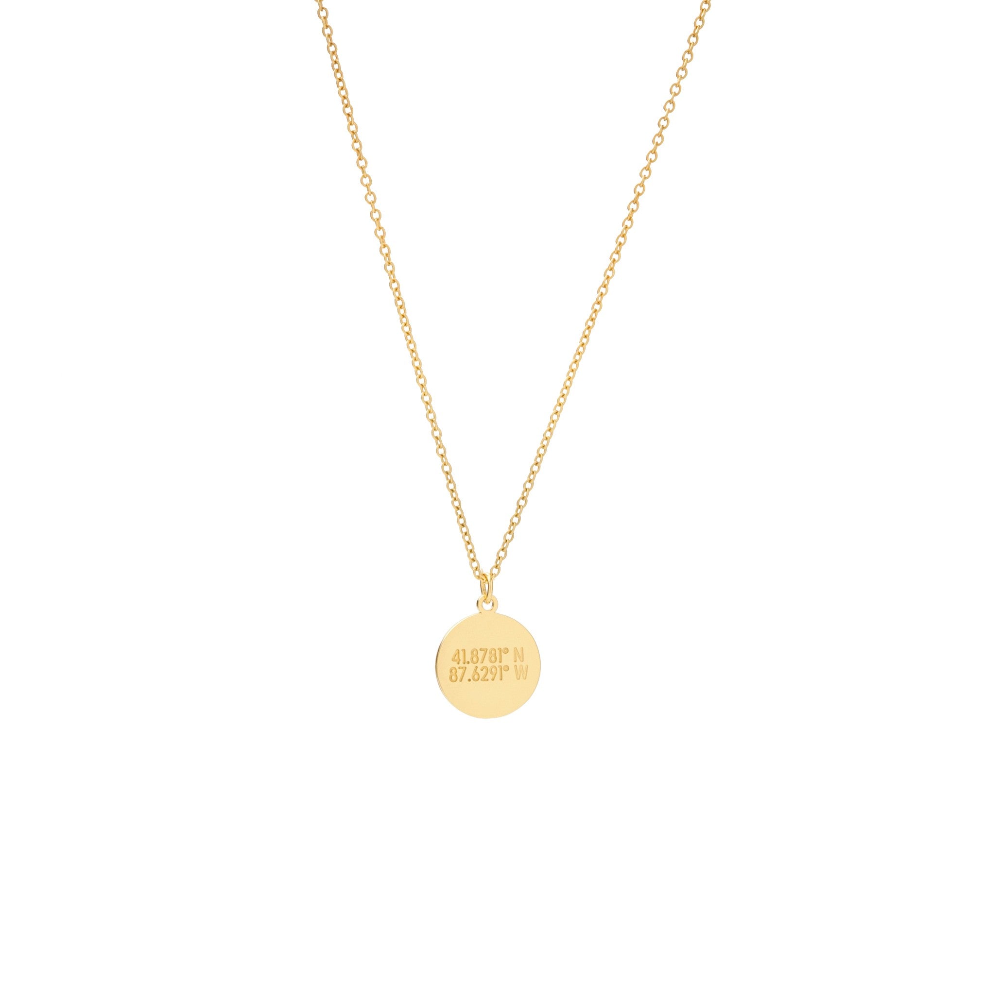 A smal flat circular gold pendant with inscription on a gold chain