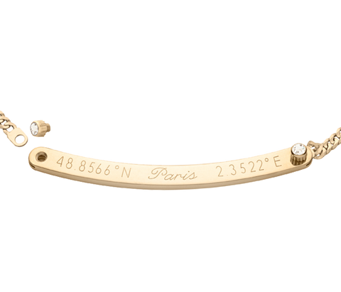 A long gold horizontal pendant with inscription on gold chain with two diamonds