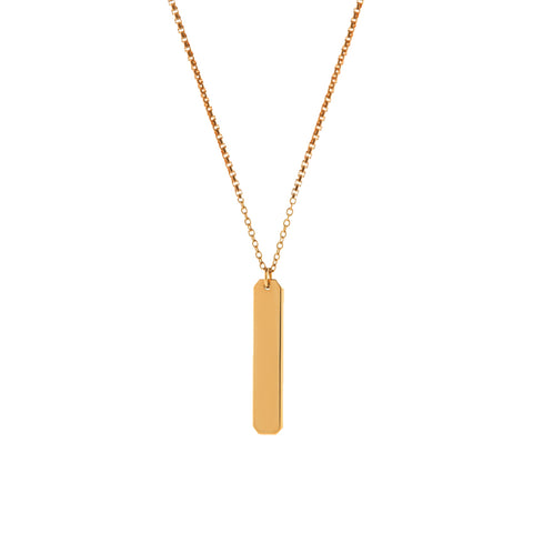 A short vertical gold pendant with inscription on a gold chain